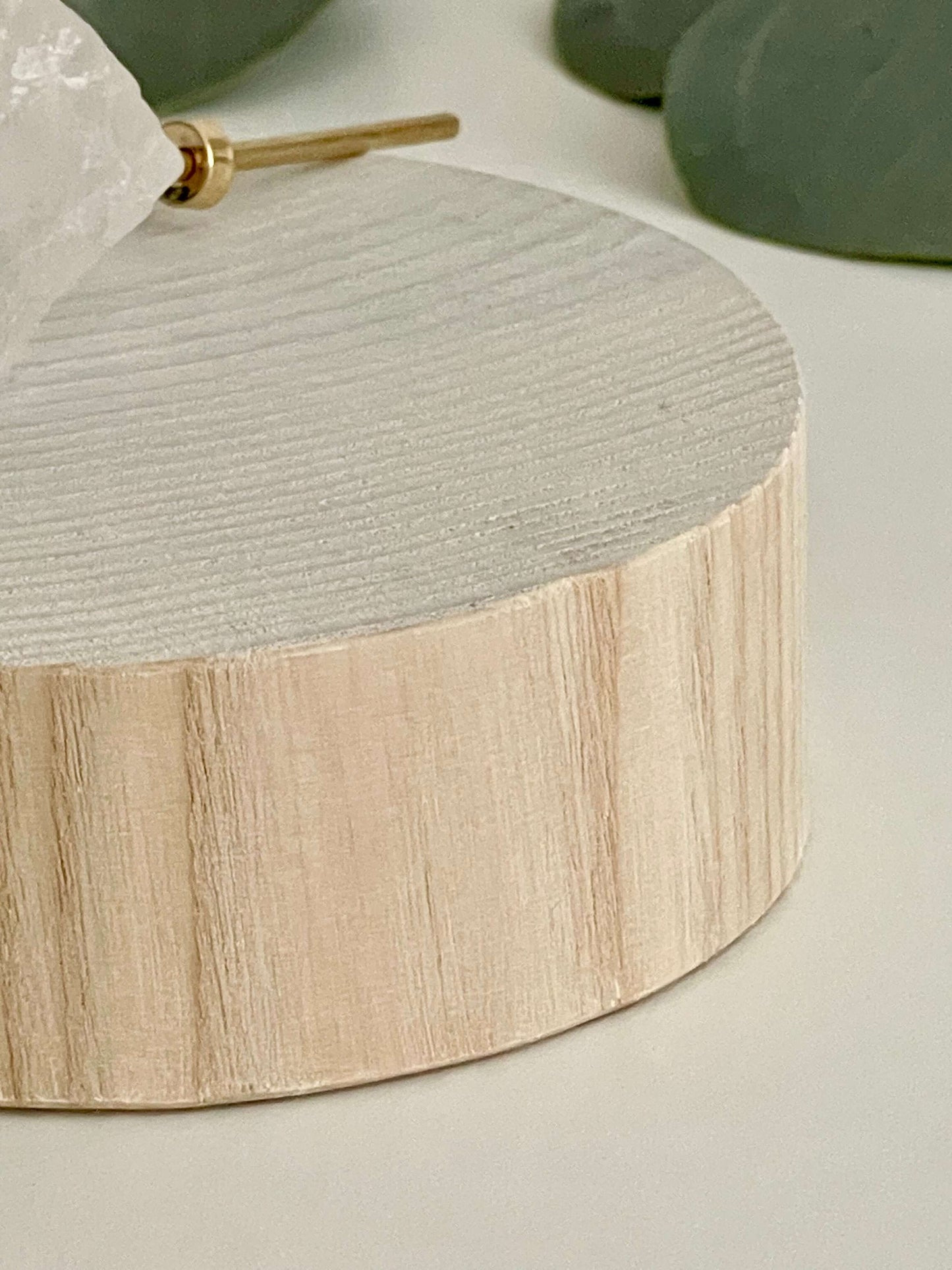 With a wooden base containing the sphere of love, quartz, and brass