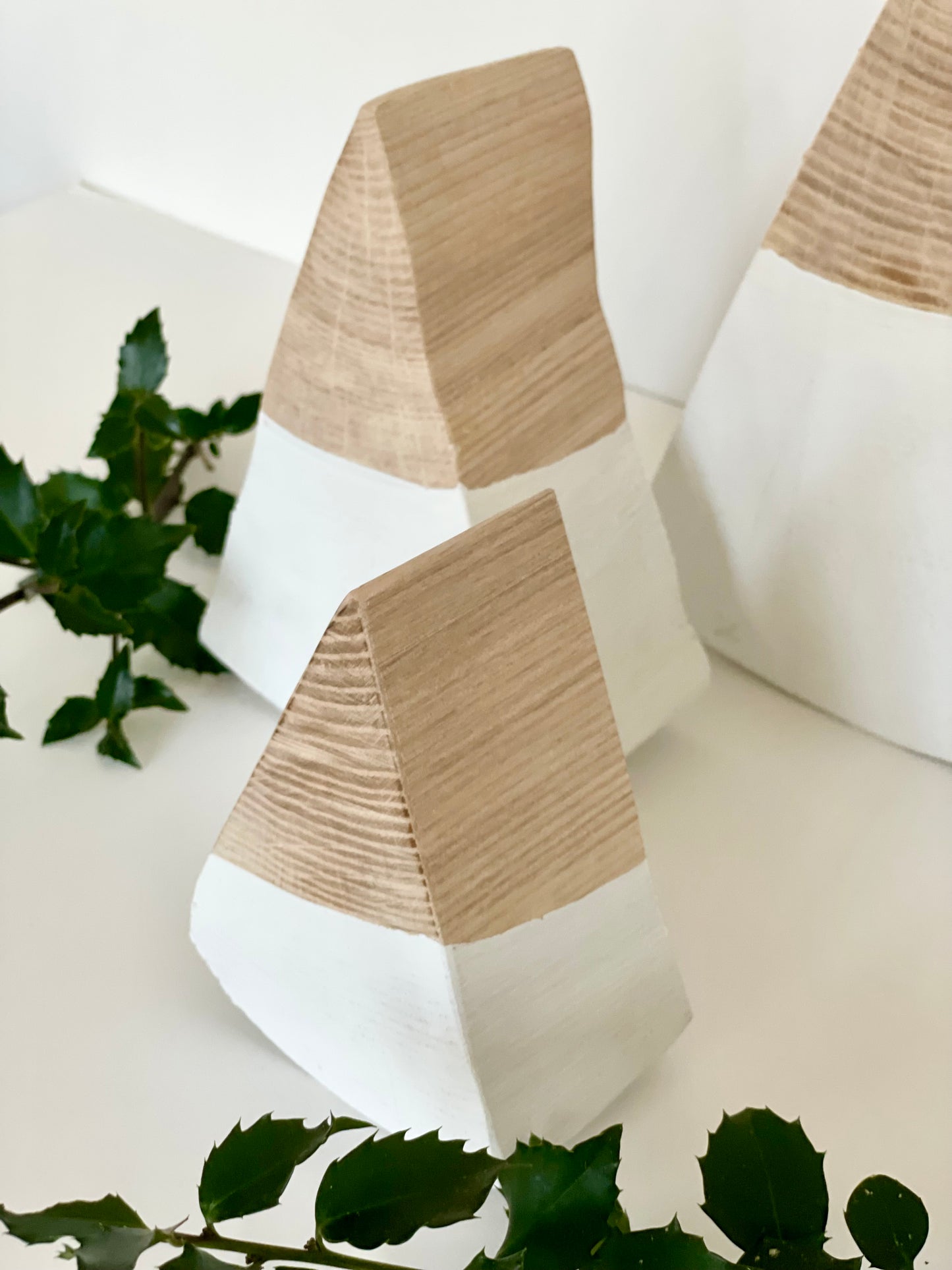 Minimalist holiday tree set with handmade wooden trees with a white base 